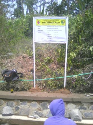 Kegiatan Pembangunan Tembok Penahan Tebing (TPT) dan Drainase Kp. Pasir Karamat RW.14 Desa Karamat M